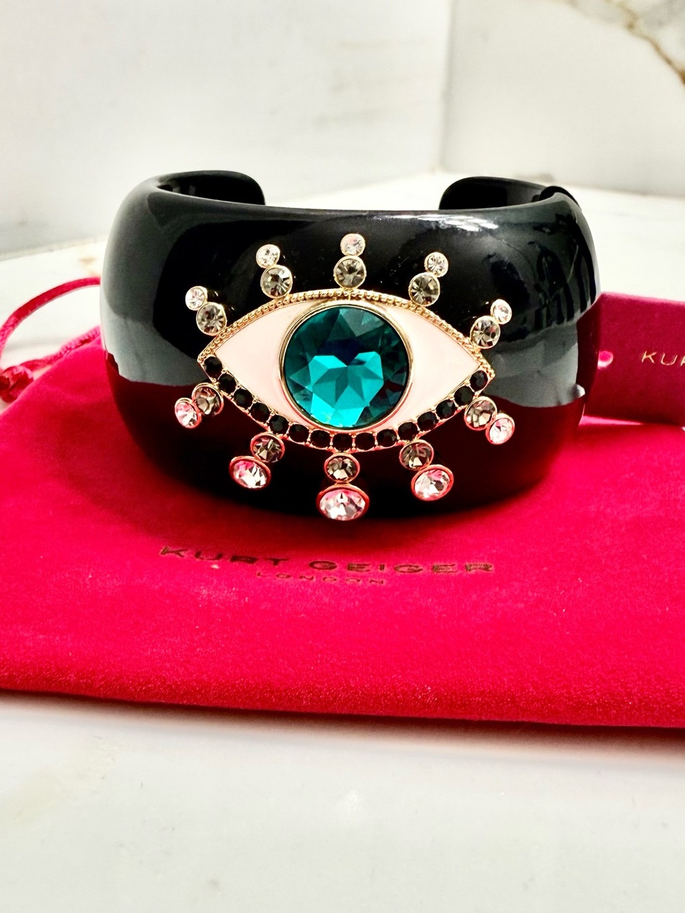 FREE Kurt Geiger Cuff Bracelet with Teal Center Eye Crystal with a $500purchase